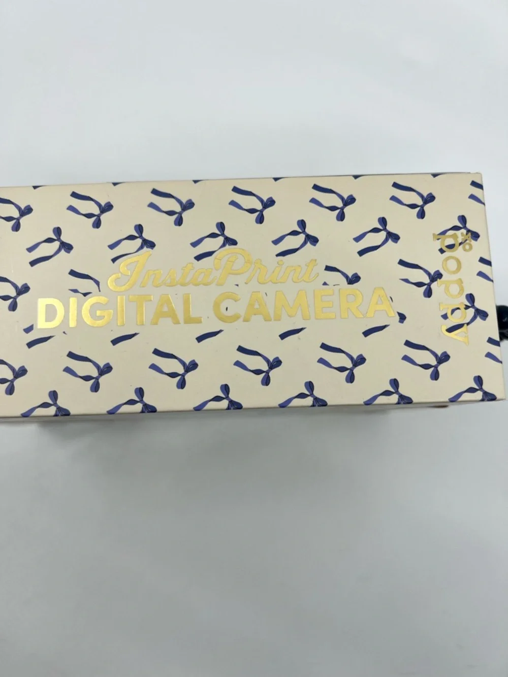 NIB XO Poppy White Digital insta-print Camera with Blue ribbon Accents